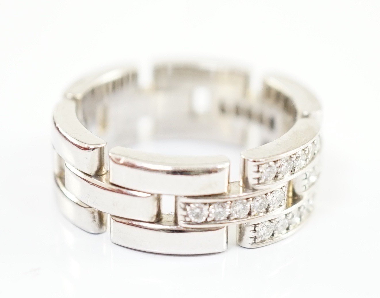 A modern Cartier 18ct white gold and diamond cluster set Panthere Maillon band